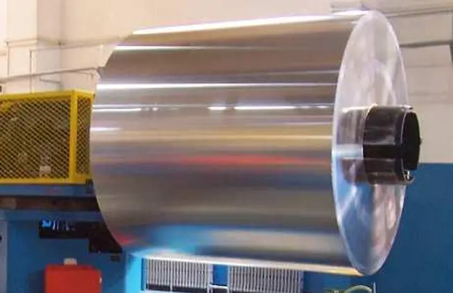 How are aluminum cans made? 1 Large aluminum alloy coil mounted on decoiler for two-piece aluminum beverage can manufacturing process