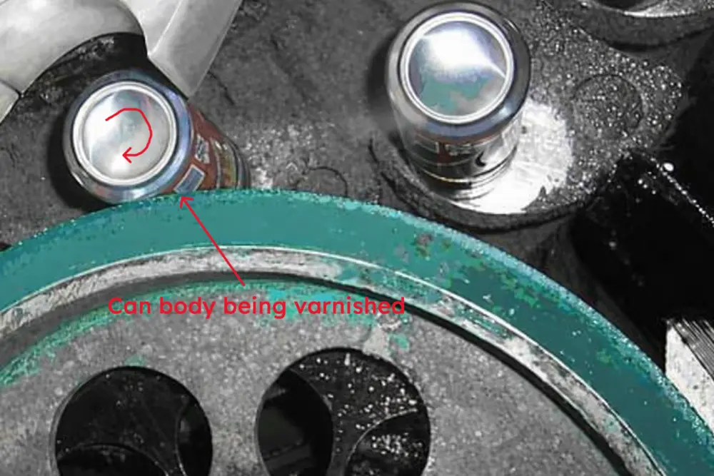 How are aluminum cans made? 17 Aluminum beverage can body being coated with protective varnish on production line