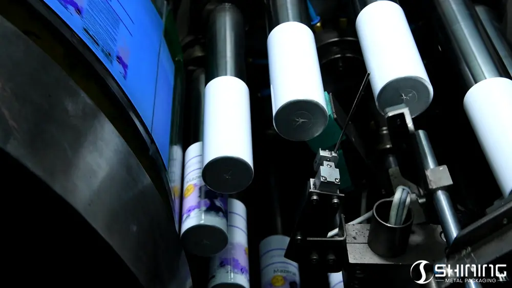 A graphic being printed onto a rotating aluminum bottle using offset technology.A graphic being printed onto a rotating aluminum bottle using offset technology.