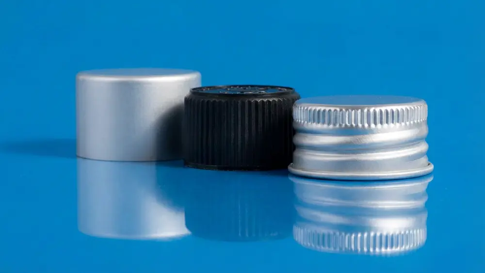 Guia de Tampas de Alumínio para Garrafas: Tipos, Especificações e Vedação 1 Tampas de rosca de alumínio e tampas compostas de plástico e alumínio para garrafas